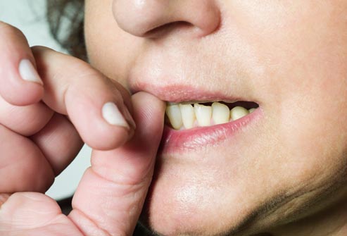 getty rf photo of woman biting nails